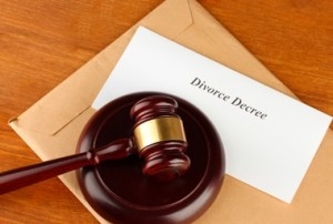 Divorce decree and wooden gavel on wooden background