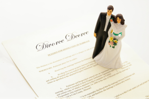 cake-topper couple on a divorce agreement